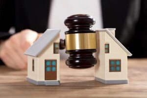 Gavel and judge splitting property for homestead exemption because of duplex, apartment, outhouse, other building or lot